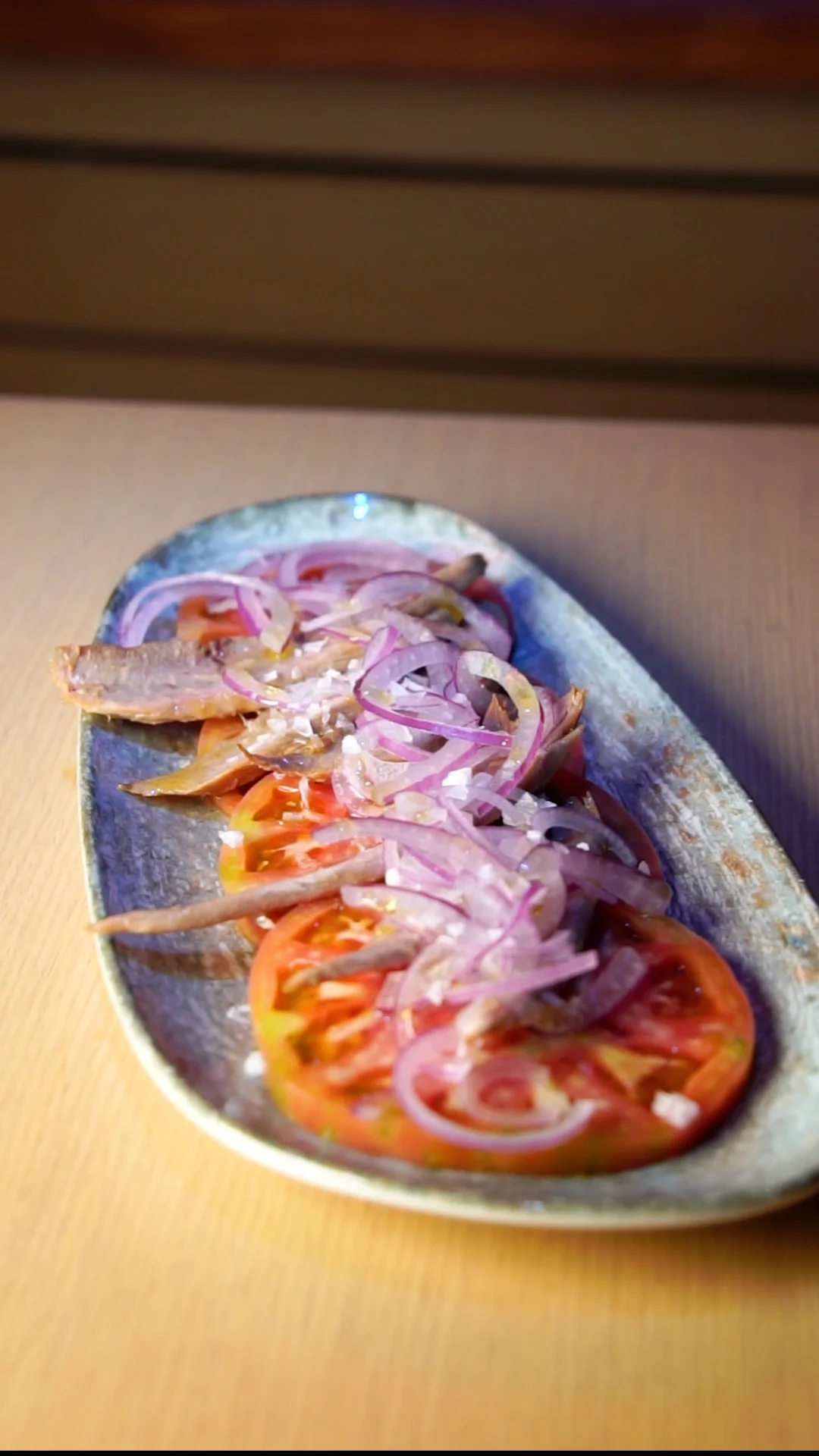 Pink tomato with tuna belly flakes, red onion, extra virgin olive oil and sea salt flakes