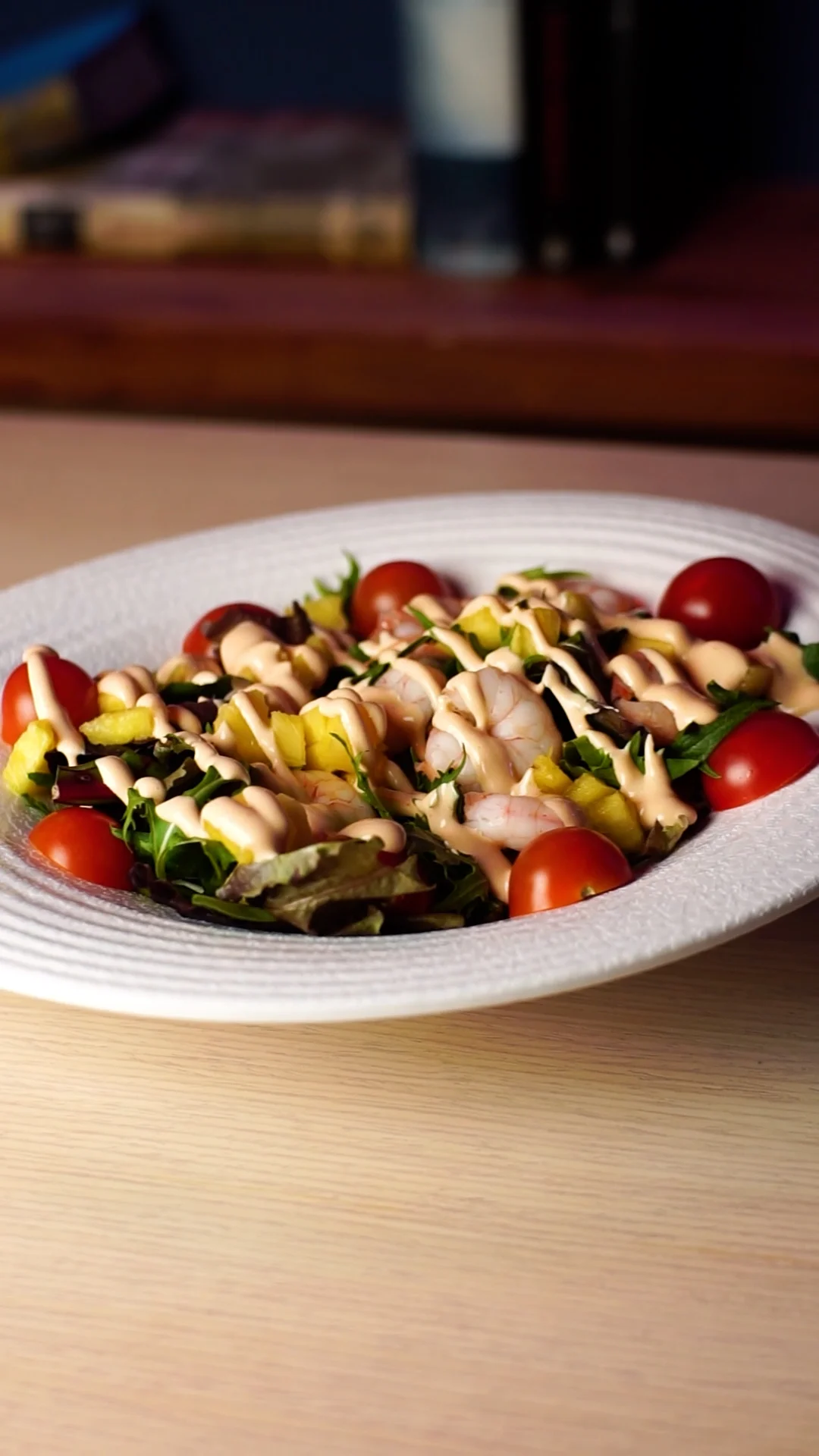 Country salad with diced fresh pineapple, prawns, cherry tomatoes and bourbon pink sauce topped with crispy onions