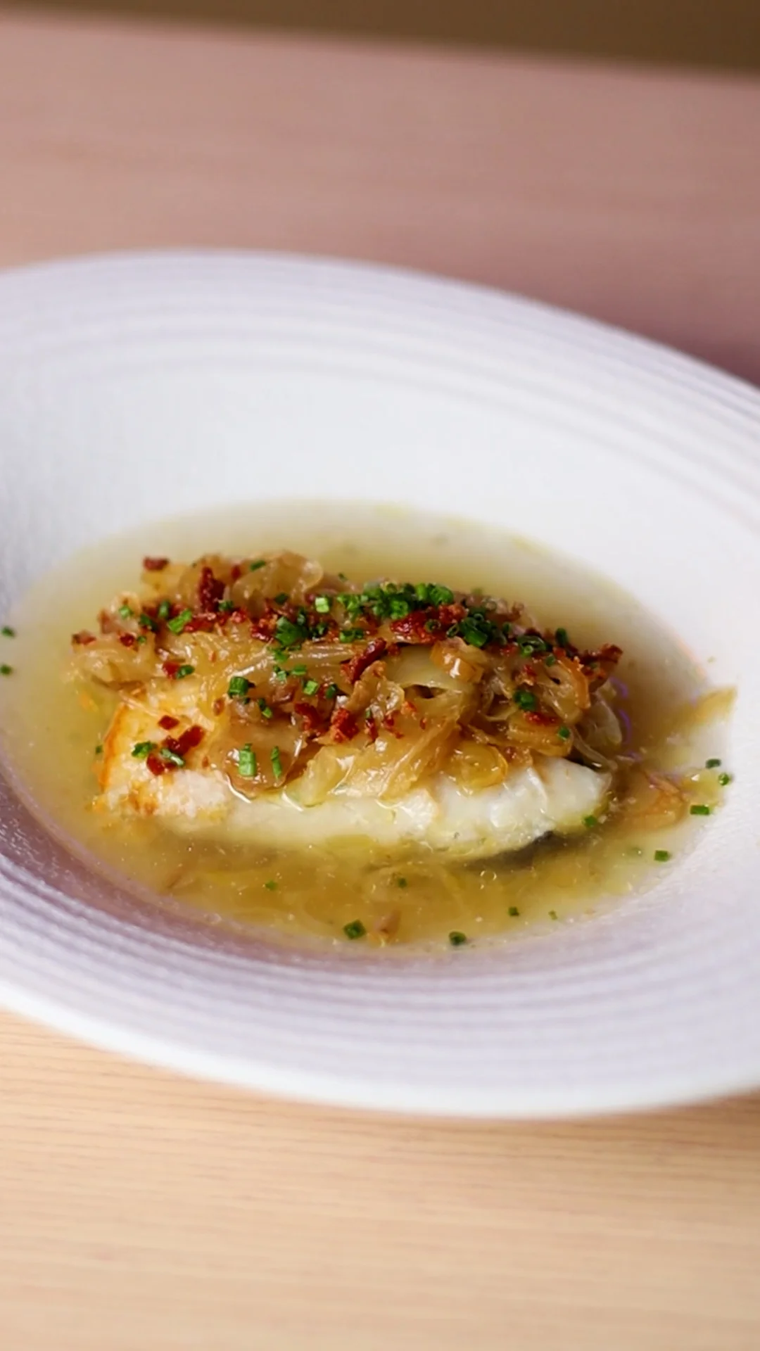 Roasted Cod with Kombu Broth and White Onion Confit with Dates and Guijuelo Sand