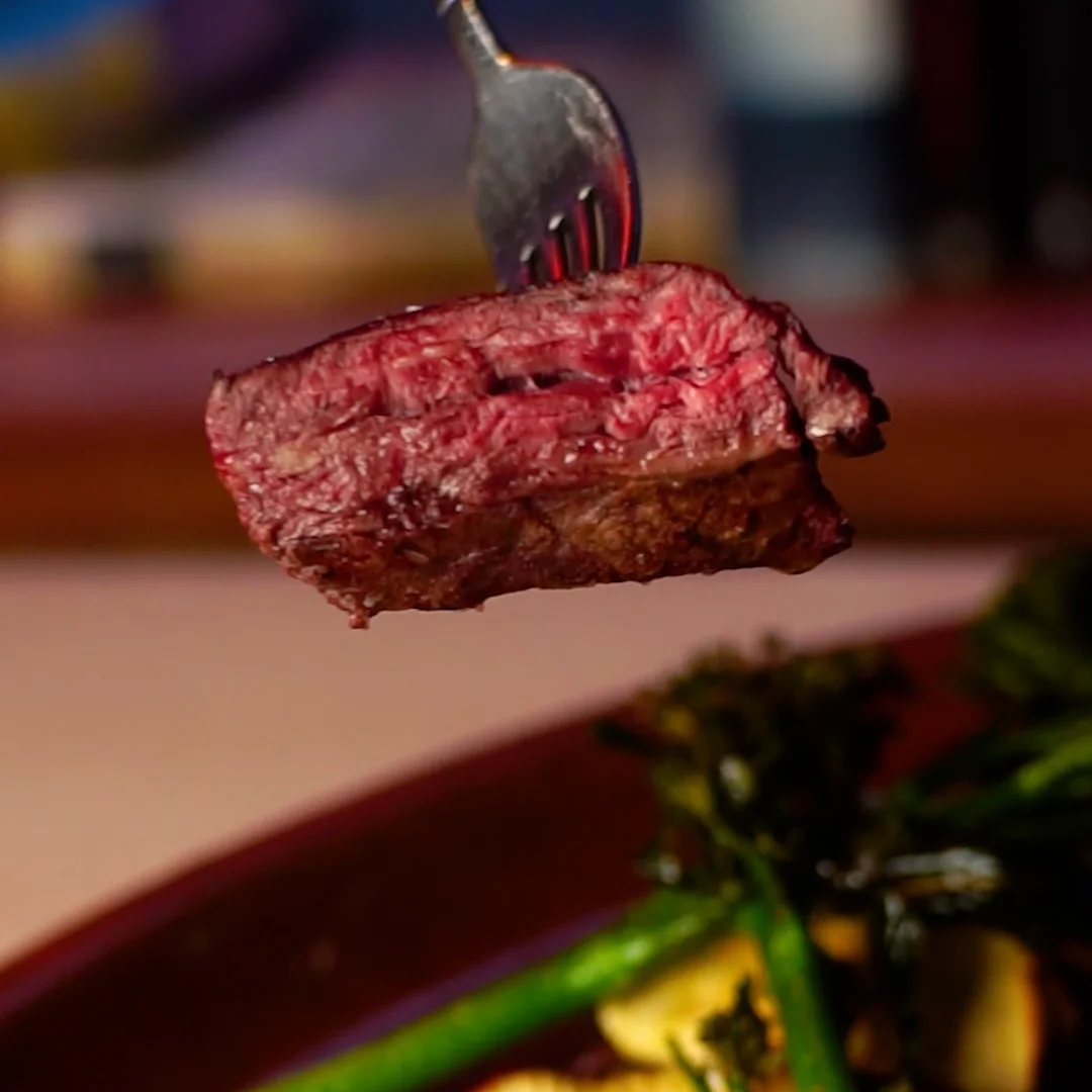 Beef skirt steak with dehydrated Fuji apple slices and fried bimis