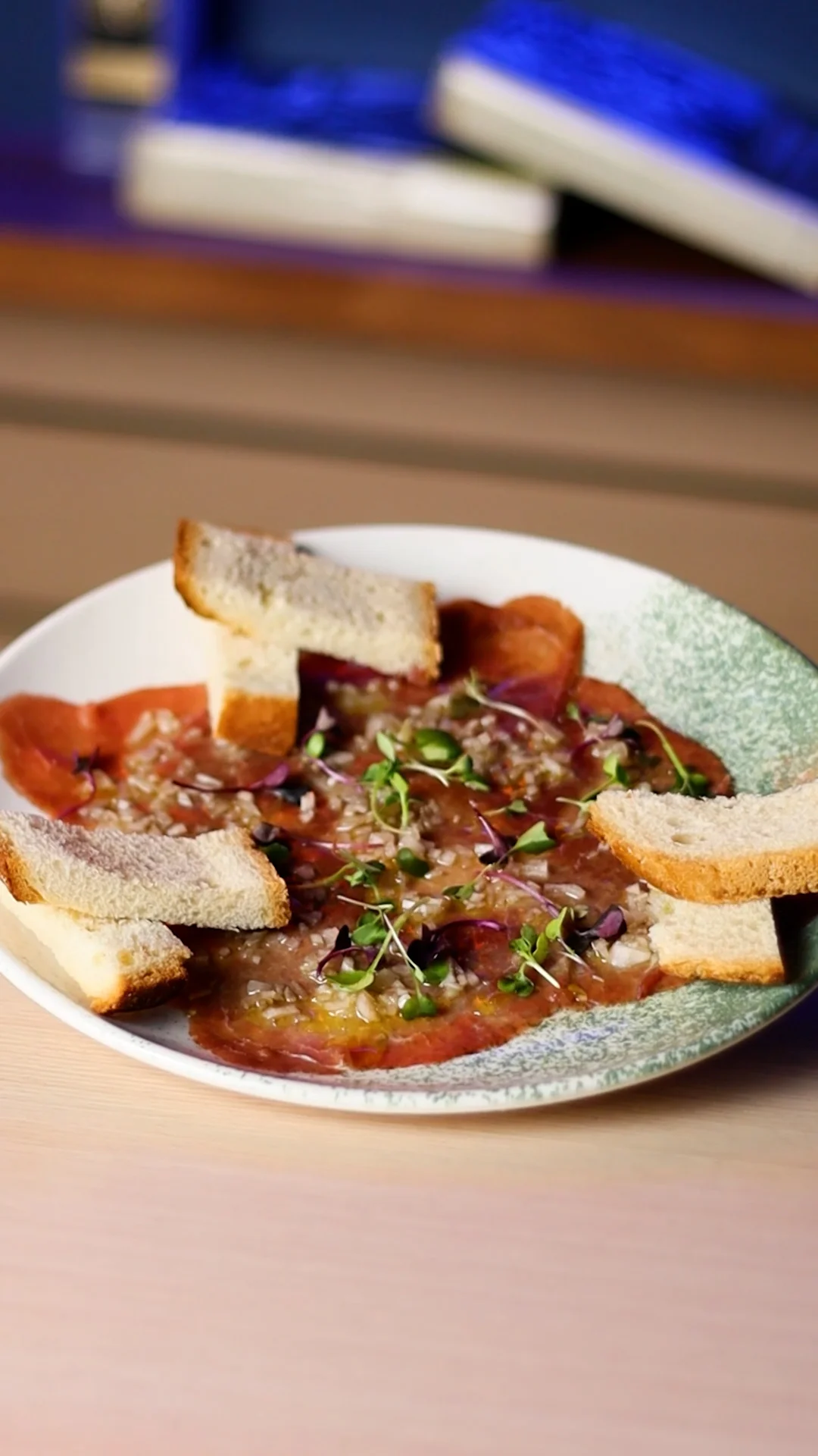 Canadian Bison Carpaccio with Shallot Brunoise Marinated in EVOO and Organic Apple Cider Vinegar with Country Bread Toasts