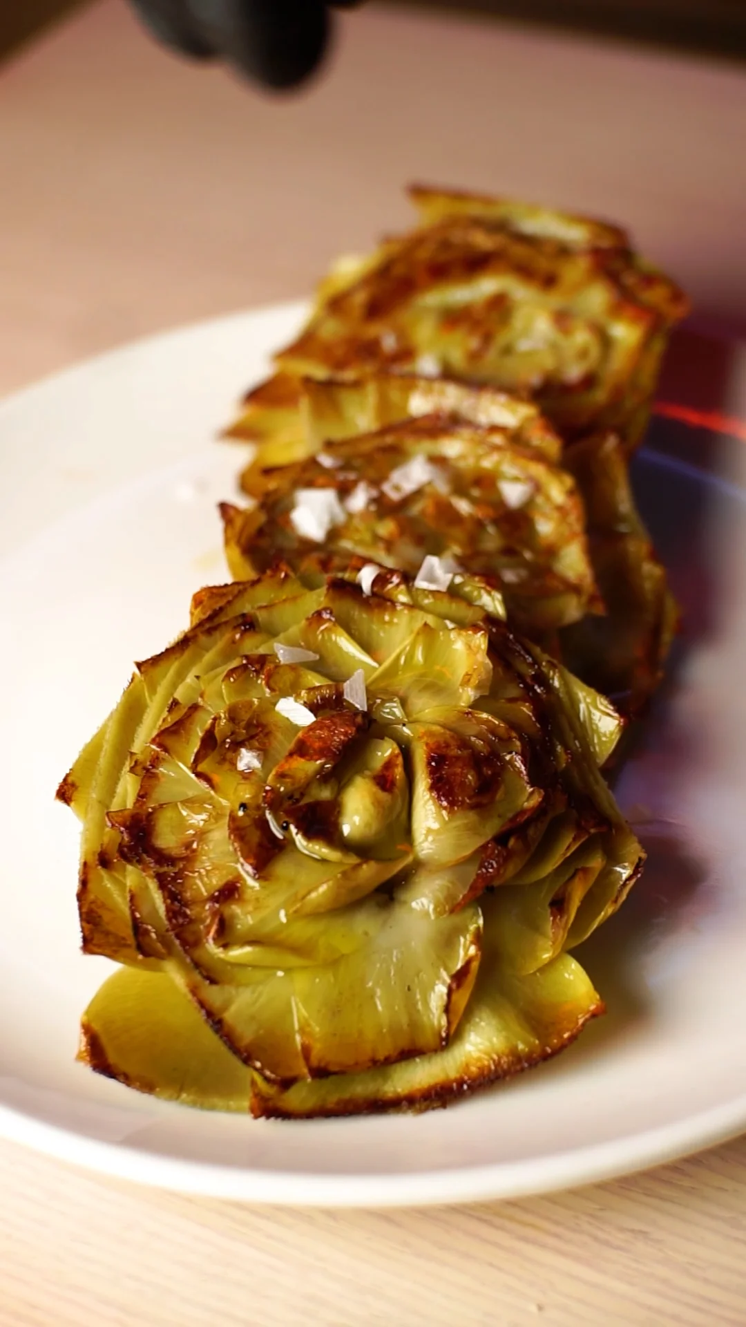 Confit artichoke hearts grilled with salt flakes